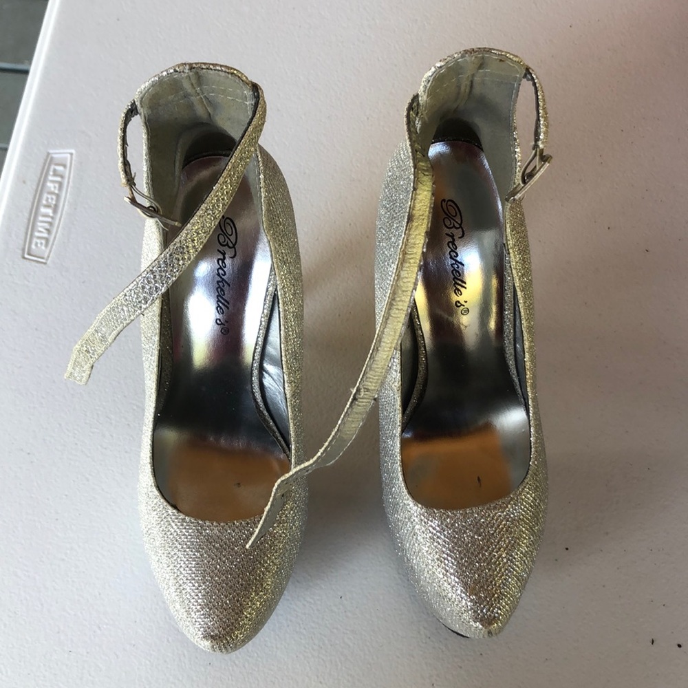 High heels. Used a few times. A few scratches.